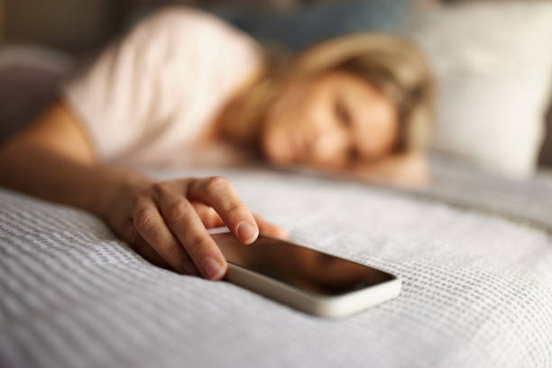 istock Snoozing my alarm on cell phone! 2197742501
