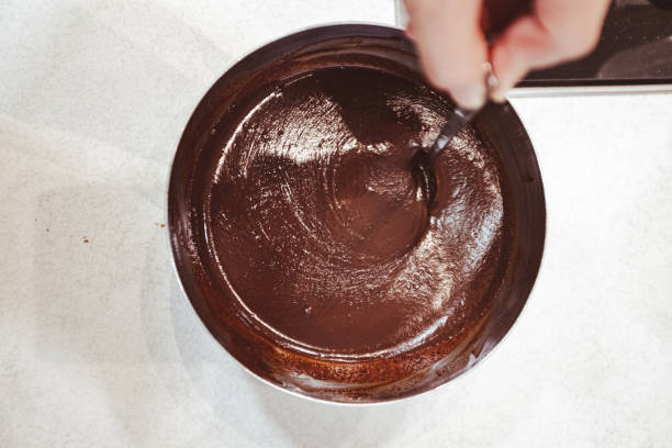 istock Creamy chocolate fondant mixing with a spoon 2197742825