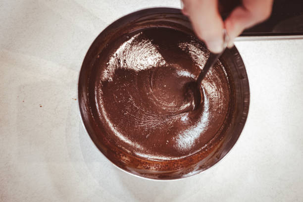 istock Creamy chocolate fondant mixing with a spoon 2197743125