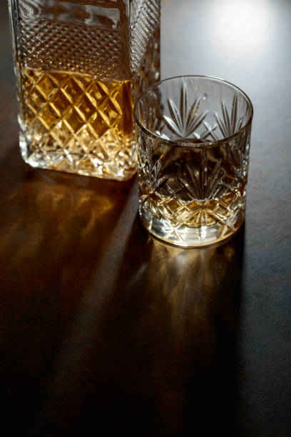 istock Decanter and cut glass tumbler with whiskey. 2197745570