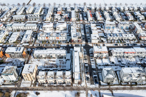 Aerial view of a residential neighborhood covered with snow in winter.