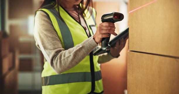 istock Hands, boxes and scan for logistics at warehouse with tablet, inventory and check with supply chain job. Person, laser and touchscreen for checklist, app and package with distribution for shipping 2197745902