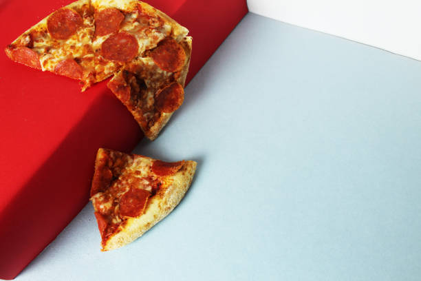 istock Pizza falling off the red pedestal 2197746823