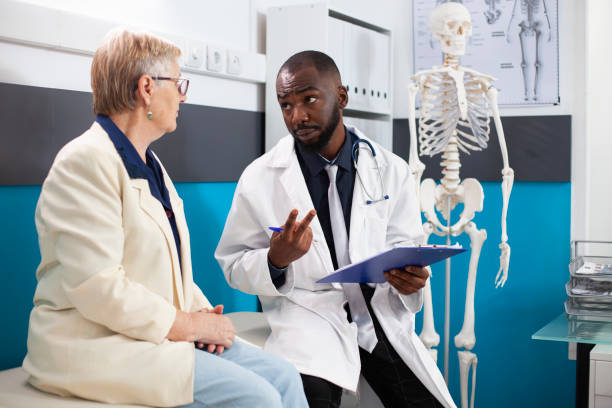 istock Physician consults with elderly woman 2197747581