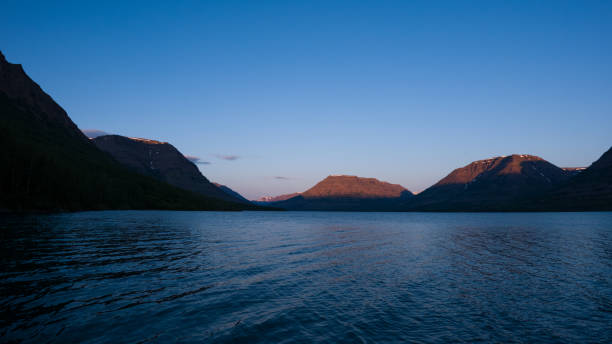 istock Golden Peaks - Sunset Over a Serene Mountain Lake 2197748203