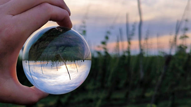 agricultural fields seen through the lens ball stock photo