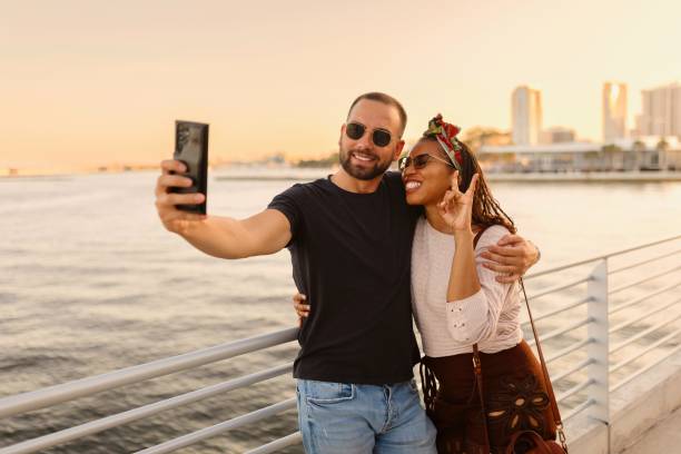 istock Portrait of a modern couple taking selfies while exploring the city 2197751695