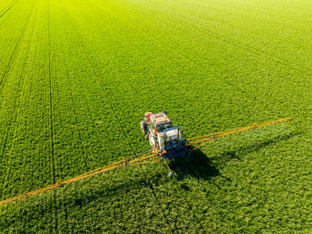 istock Agricultural crops sprayer in a wheat field seen from above 2197752511