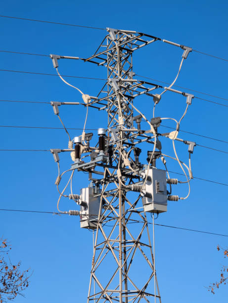 istock pole, electricity, energy, transmission. wires, device, technology, sky, blue, sunny, 2197753439