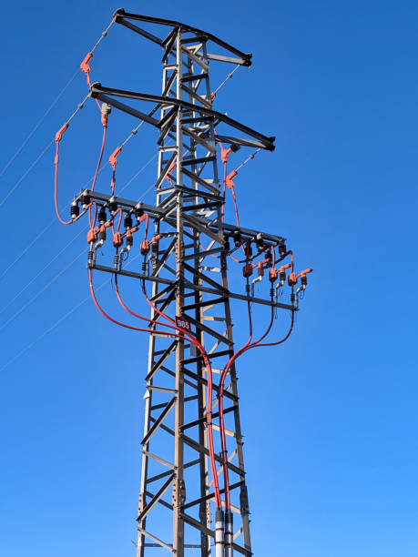 istock pole, electricity, energy, transmission. wires, device, technology, sky, blue, sunny, 2197753534