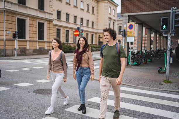 istock Students walking on pedestrian crossing in malmo, sweden 2197753625