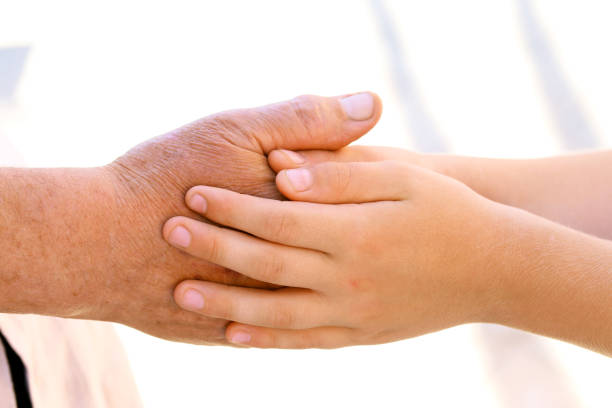 Grandson holding Grandmothers hand
