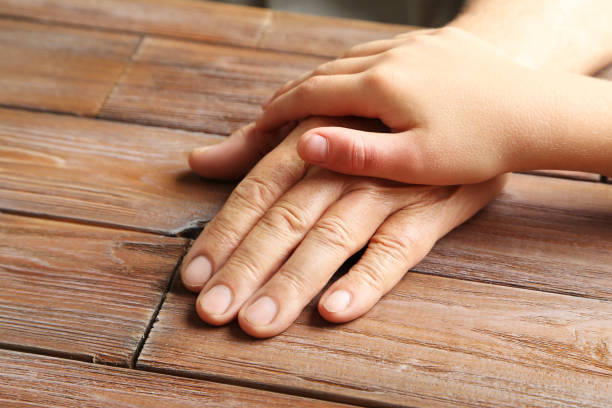 istock Hands of young child and old senior 2197753695