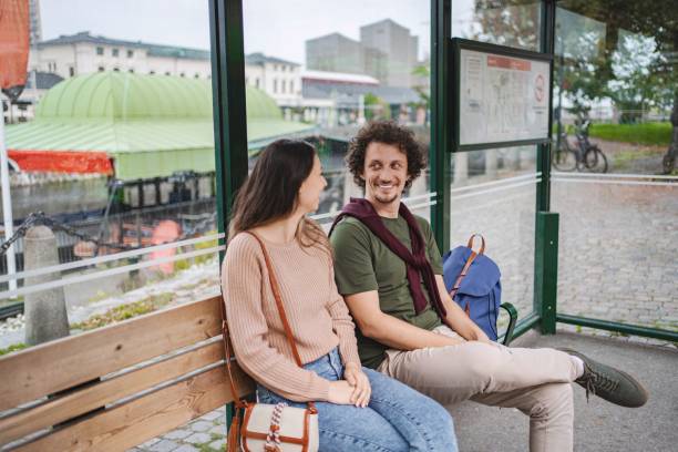 istock Tourists waiting at bus stop in malmo, sweden, enjoying conversation 2197753704