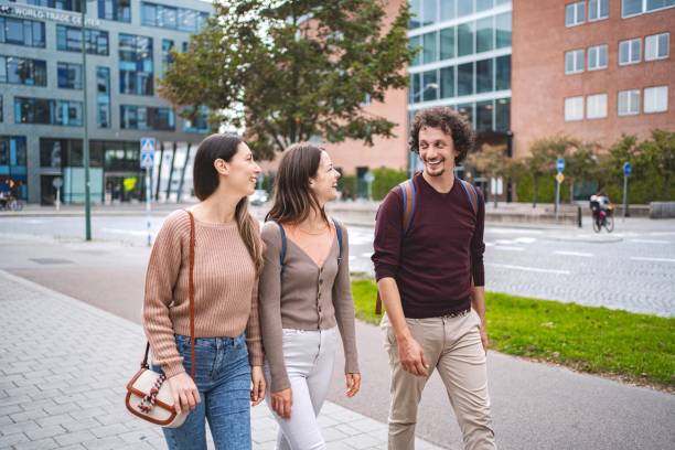 Students walking and talking together in malmo, sweden