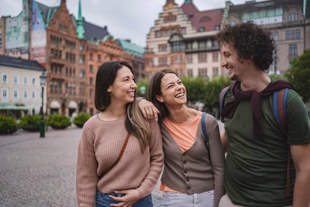 istock Tourists walking and laughing in malmo, sweden 2197753753