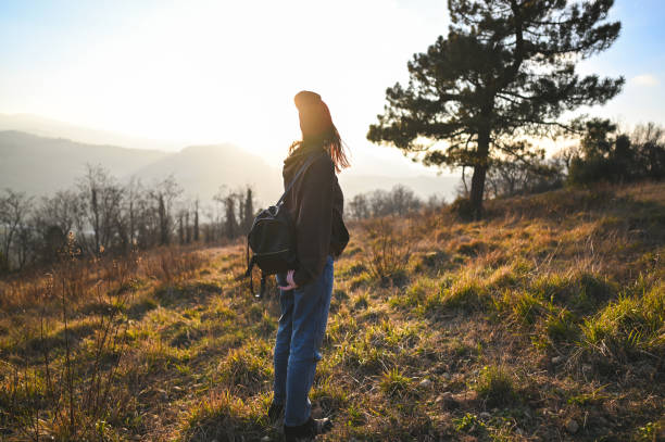 istock Woman looking at sunset. 2197756451