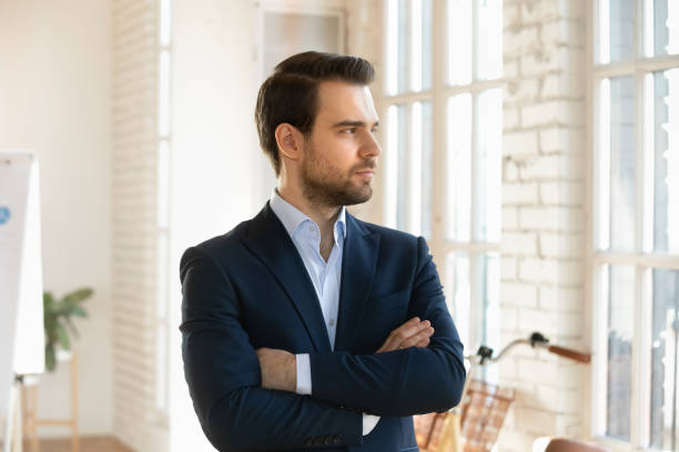 istock Serious handsome business leader man posing with hands folded 2197757275