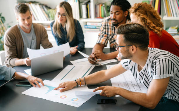 istock Successful multiethnic group of designers, architects, business people at work in office 2197757489