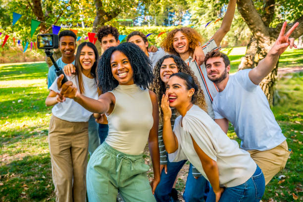 istock Happy multi-ethnic friends taking a selfie at the park 2197759528