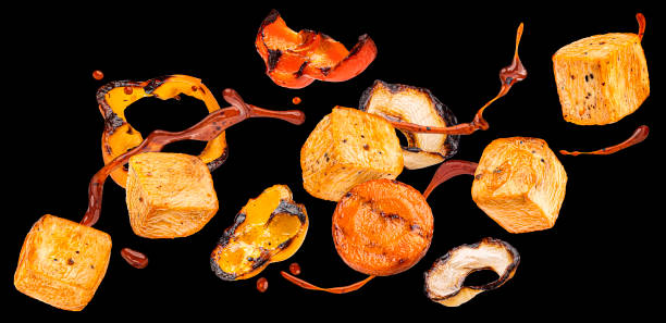 istock Grilled chicken meat cubes isolated on black background 2197760344