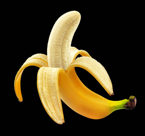 Half peeled banana isolated on black background