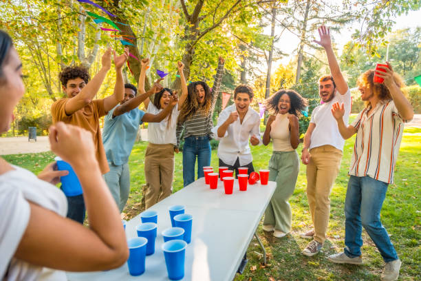 istock Friends playing beer pong in the park 2197761101