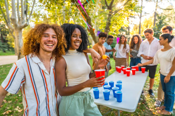 istock Young people playing beer pong at a park party 2197761320