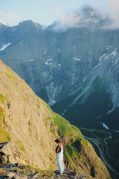 istock Female Hiker Contemplating Sunset Mountains Views From Above 2197763655