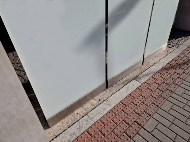 istock plexiglass inserted into a stainless steel bar. stand glass board is an information board entrance to an industrial building with names of companies. office park or hospital building with pavilion 2197763992