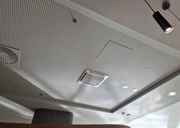 istock perforated plasterboard ceiling panels shatter echo in a large hall with tiled floor. entrance hall in a hotel where sounds must be muffled, press, surround sound 2197764973