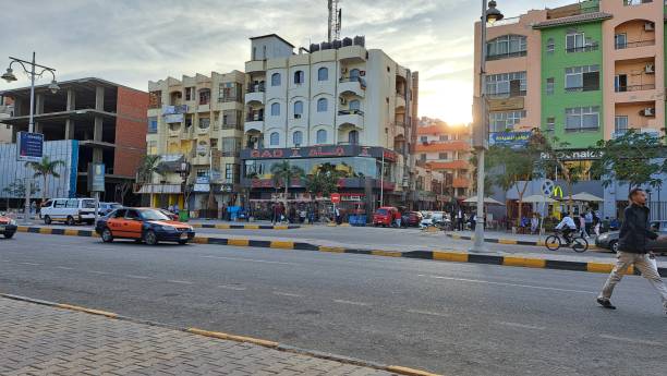 Sheraton Road, Hurghada, Egypt - Daytime scene featuring the street’s diverse architecture, restaurants (GAD, McDonald’s), traffic, and pedestrians. A vibrant view of Hurghada life