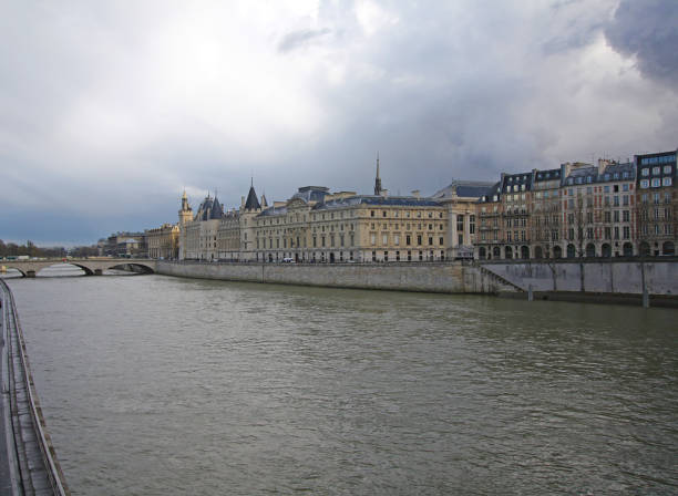 istock Scenic river view with buildings and tranquil cloudy sky 2197767905