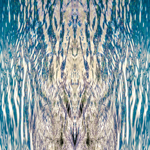 Blue and purple. Abstractions for defining psychological state, waves in sun glare, surface of the sea and its vertically symmetrical reflection