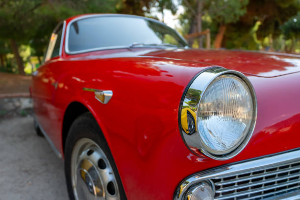 Side view of red classic American sports car