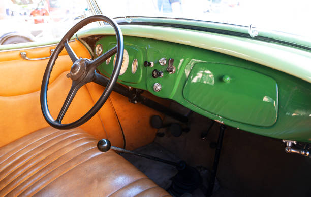 istock Vintage car interior with classic steering wheel. 2197778485