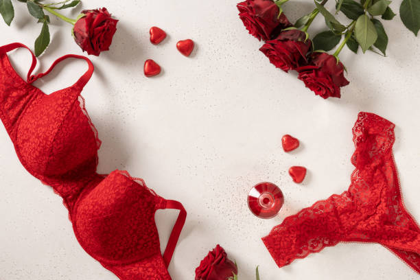 istock Valentine's day frame. Red lace bustier underwear, candy sweets and red roses 2197779685