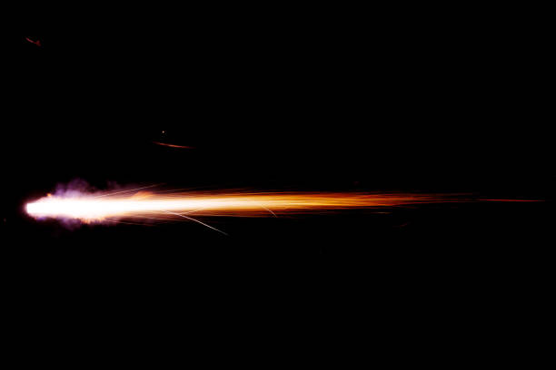 A shot from a firearm on a black background