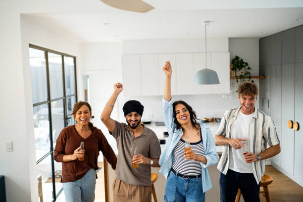 istock Group of Friends Dancing in a Modern Home Setting 2197780762