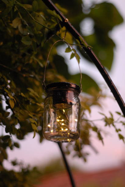 istock Hanging jar lantern with fairy lights at dusk 2197780848