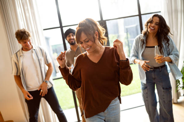 istock Young Friends Dancing and Enjoying a Fun Home Party Together 2197780850