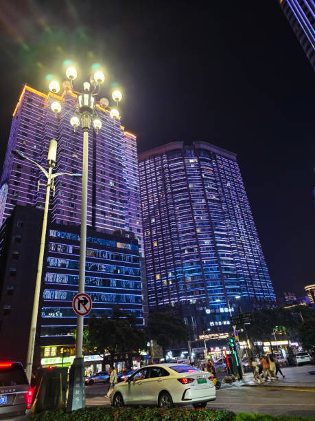 Macau / Macao, China - December 29, 2018: Hotels, casinos and resorts facades at night view in Macao / Macau in a winter holiday christmas season.Formerly a Portuguese colony, the territory of Portuguese Macau was first leased to Portugal by the Ming dynasty as a trading post in 1557. Portugal paid an annual rent and administered the territory under Chinese sovereignty until 1887. Portugal later gained perpetual colonial rights in the Sino-Portuguese Treaty of Peking. In those days Macao / Macau is referred to as the \