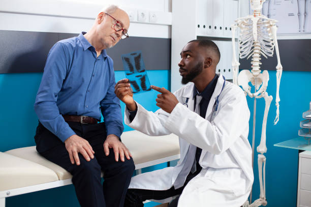 istock Doctor and old man looking at xray image 2197781798