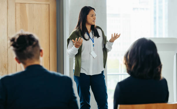 istock Professional woman speaking at a business workshop to colleagues 2197782014