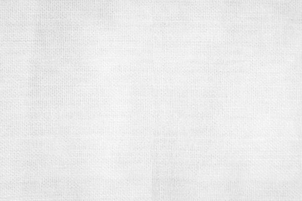 istock White color fabric canvas woven texture background in pattern light blank. Natural gauze linen, carpet wool and cotton cloth textile textured as clean empty for decoration text. Grey sack material. 2197782568
