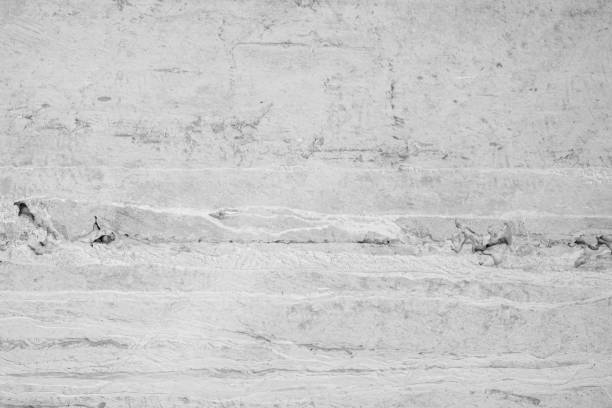 Concrete or stone texture for background in black, grey and white colors. Cement and sand wall of tone vintage grunge outdoor polished concrete texture. Building rough pattern floor decorating empty.