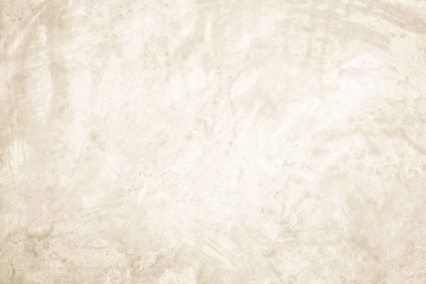 istock Dark old concrete wall texture background. Close Up retro plain cream color cement wall background texture. Design paper vintage parchment element show or advertise or promote product on display. 2197782621