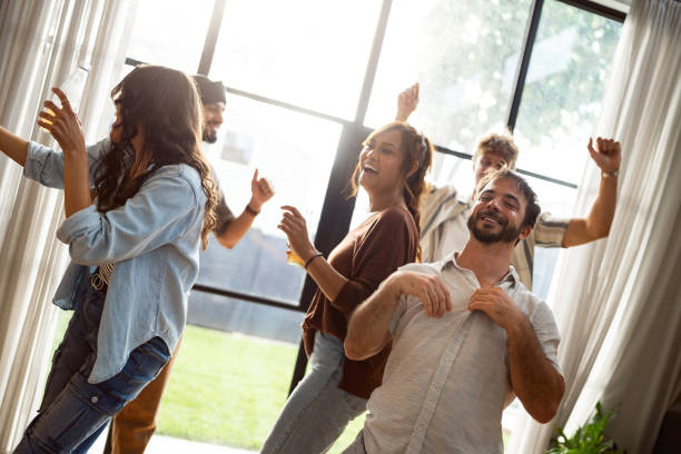 istock Group of Friends Having Fun and Dancing at a Home Party 2197784263