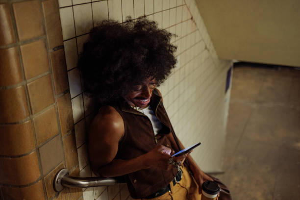 istock Stylish young man using phone in subway station 2197789533
