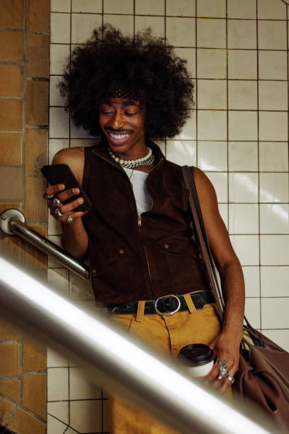 istock Stylish young man using smartphone in subway station 2197789536